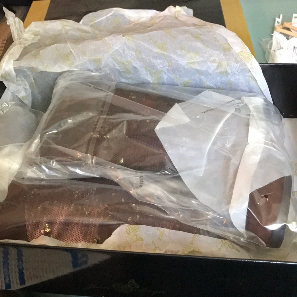 Chocolate colored sequined high boots.